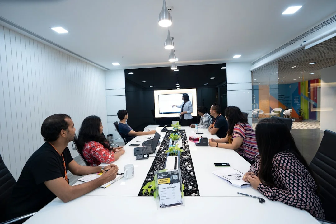 Colleagues celebrating success in a modern digital marketing office with teamwork and collaboration.